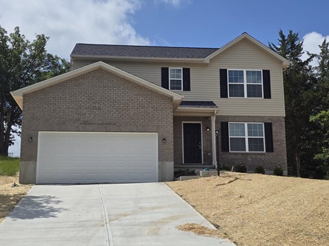 A two-story house with a garage is shown.